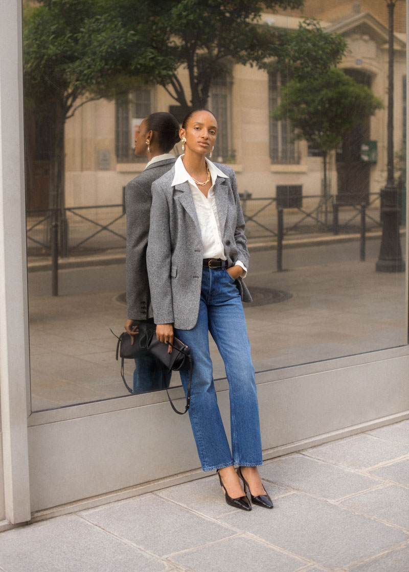 Girl in mid-wash denim jeans and blazer from & Other Stories