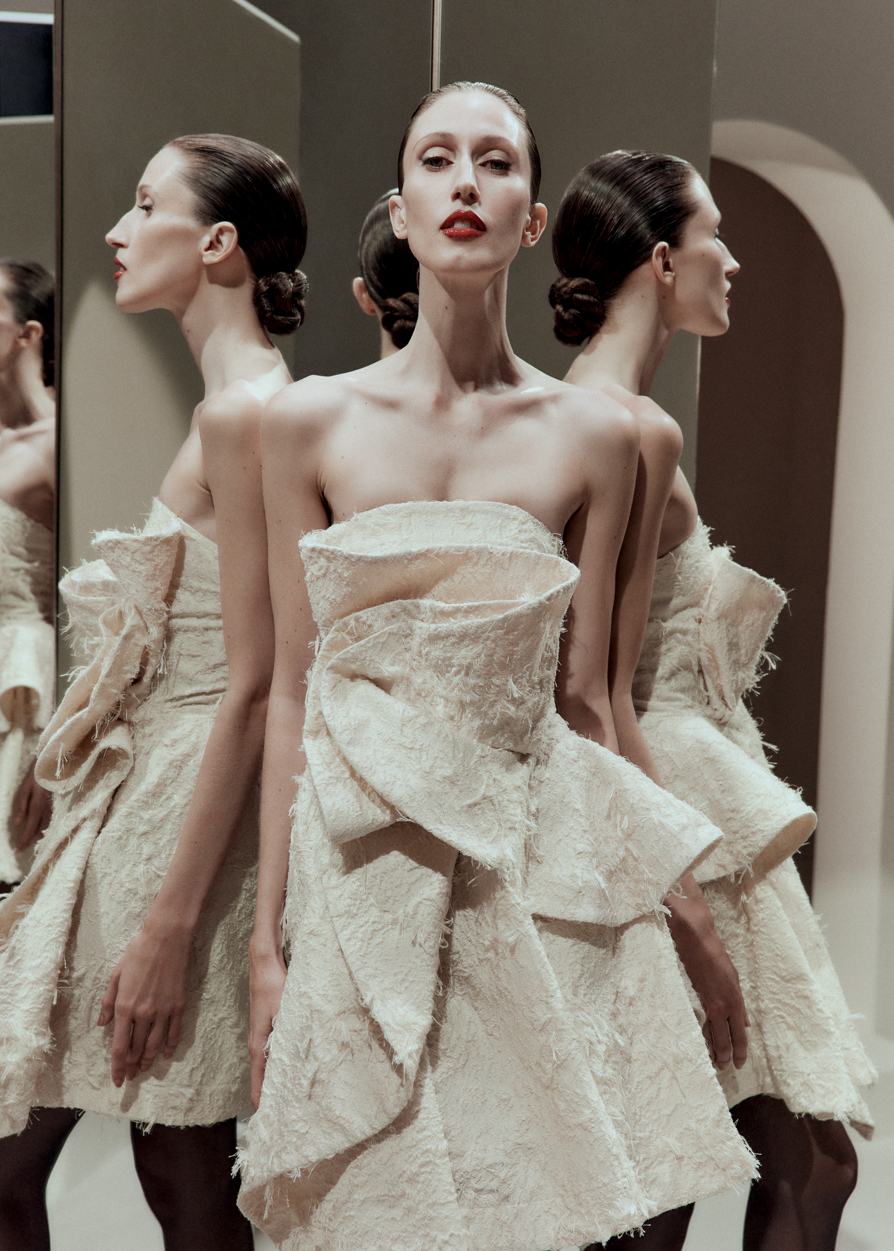 Woman in cream coloured strapless dress