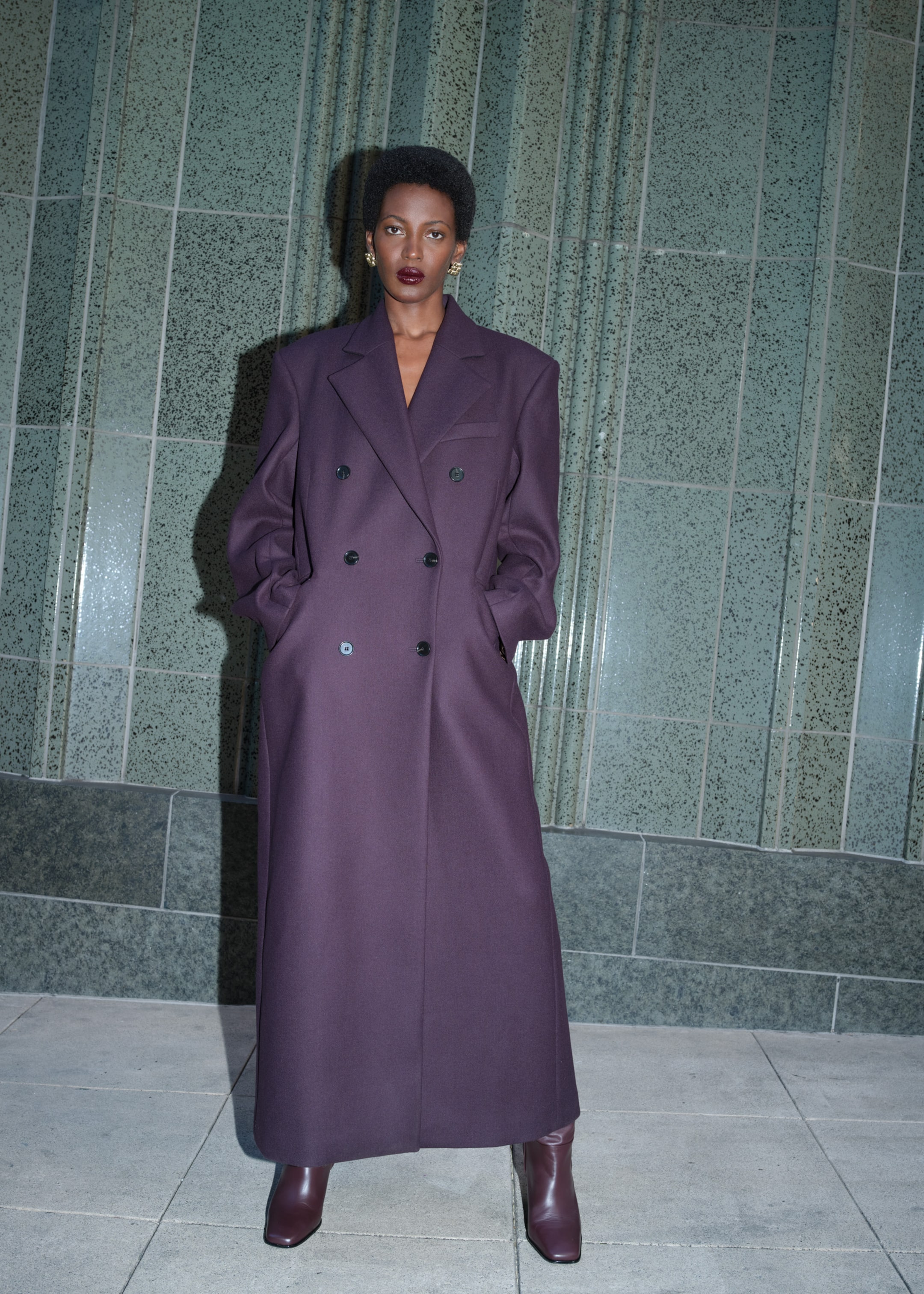 Woman in burgundy long coat